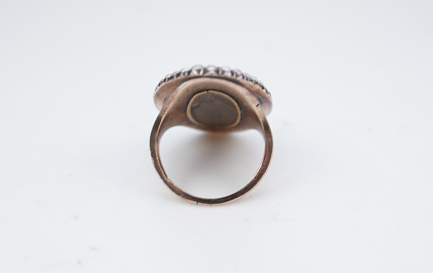 A fine George III seed pearl, enamel and diamond mourning ring, circa 1782